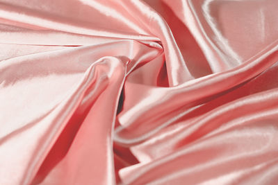 Circular spiral fabric, pink satin fabric, cloth background, , twisted background