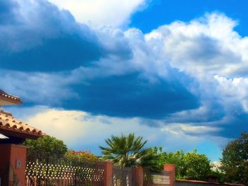 Low angle view of built structure against cloudy sky