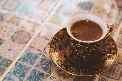 Close-up of coffee cup on table