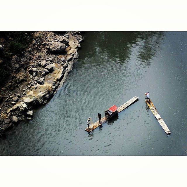 transfer print, water, auto post production filter, nautical vessel, men, boat, transportation, lifestyles, waterfront, leisure activity, high angle view, mode of transport, lake, nature, travel, reflection, river, tranquility, day