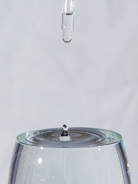 Close-up of wine glass against white background