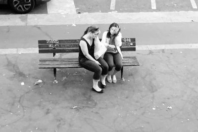 Young woman sitting outdoors