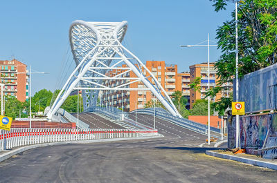 View of bridge and buildings against sky