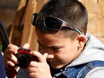 Portrait of man photographing with camera