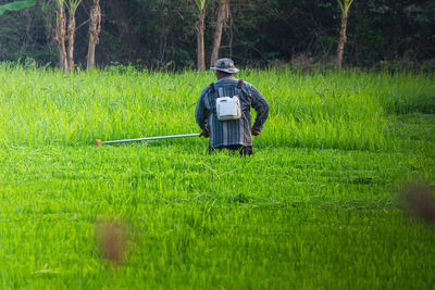 Full length of man working on field