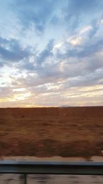 Scenic view of landscape against sky during sunset