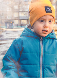 Portrait of boy standing outdoors