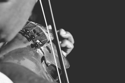 Cropped image of person playing violin