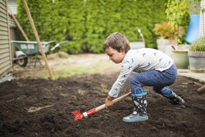 Boy playing in mud