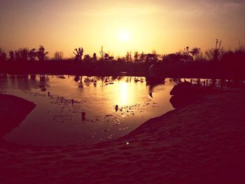 Scenic view of sunset over river