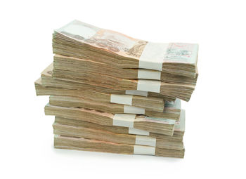 Close-up of stacked stack over white background