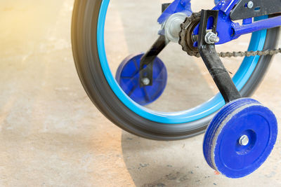 Close-up of bicycle wheel spinning outdoors