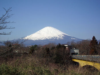 View of snowcapped mountains against blue sky