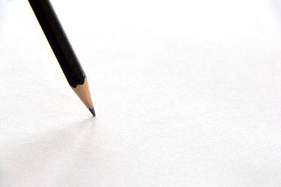 High angle view of pencils on white background