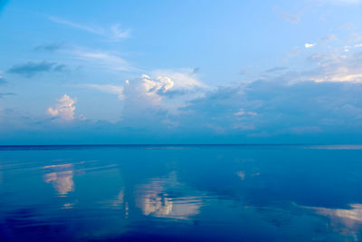 View of calm sea against cloudy sky