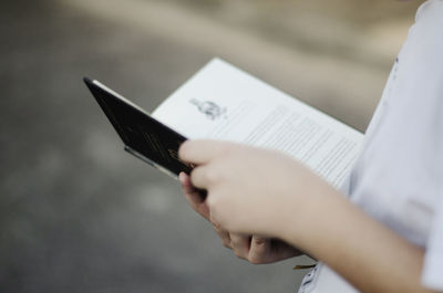 Close-up of hand holding book