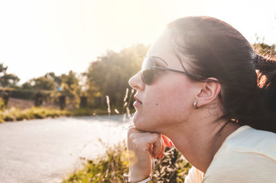 Close-up of woman looking away outdoors