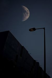 Low angle view of buildings against sky at night