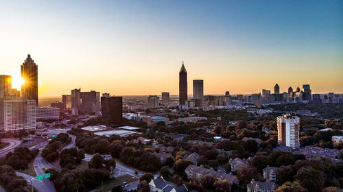 View of buildings in city during sunset