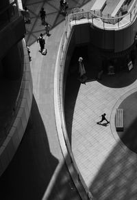 High angle view of people walking in town square
