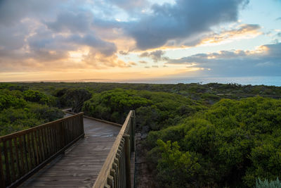 Scenic view of bridge against sky during sunset