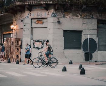 People riding bicycle on street