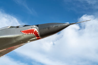 Combat aircraft fighter bomber on a blue sky background