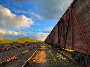 Train on railroad tracks against sky