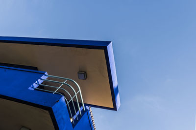 Low angle view of building against clear blue sky