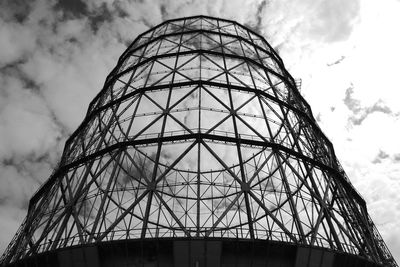 Low angle view of building against cloudy sky