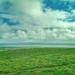 Scenic view of sea against cloudy sky