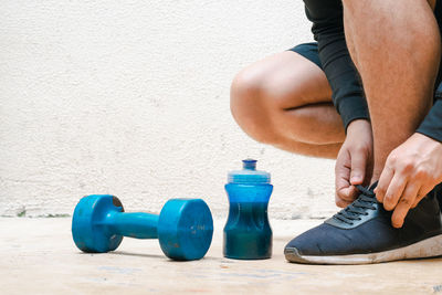 Low section of woman exercising in gym