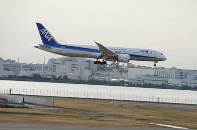 Airplane flying in sky