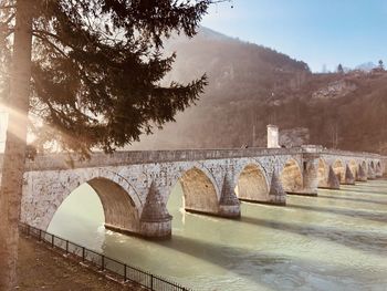 Arch bridge over river