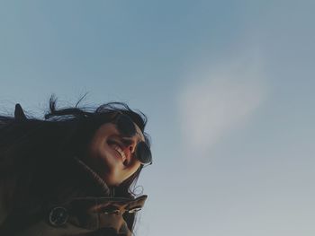 Woman wearing sunglasses against sky