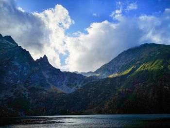 Scenic view of mountains against cloudy sky