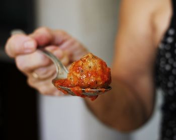 Close-up of hand holding ice cream