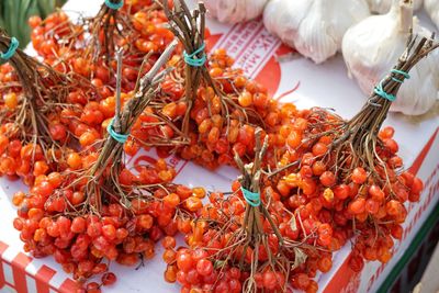 Close-up of red berry fruits bundle at market stall