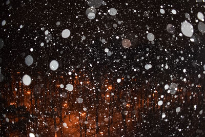 High angle view of silhouette people on ice at night