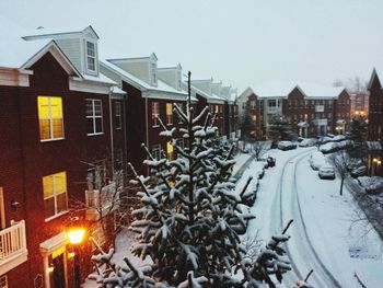 Houses against sky during winter