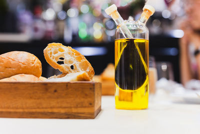 Appitizer sourdough bread with olive oil and balsamic vinegar on dinner table.