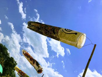 Low angle view of old metal structure against blue sky