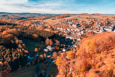 High angle view of autumn trees against sky