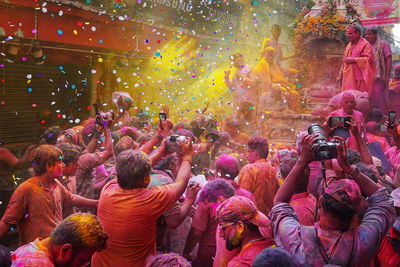 Holi craze. people of kolkata are celebrating colorful festival of holi on the street of india.