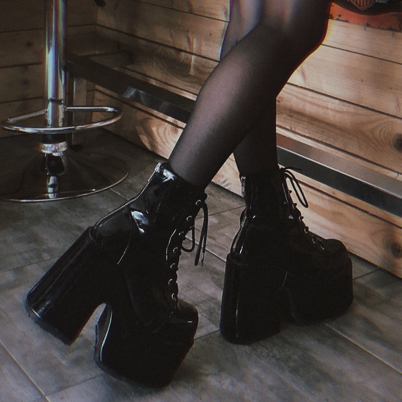 black, human leg, shoe, adult, one person, low section, limb, human limb, high heels, indoors, clothing, women, fashion, flooring, footwear, young adult, lifestyles, pantyhose, fashion accessory, hardwood floor, arts culture and entertainment, human foot, stiletto, tights, person