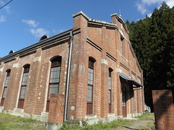 Low angle view of old building against sky