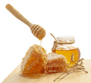 Close-up of cake on table against white background