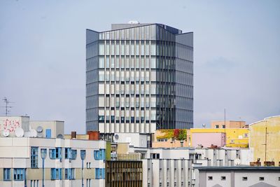 Low angle view of modern buildings against sky