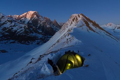 Scenic view of snow covered mountain against sky