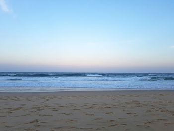 Scenic view of beach against clear sky